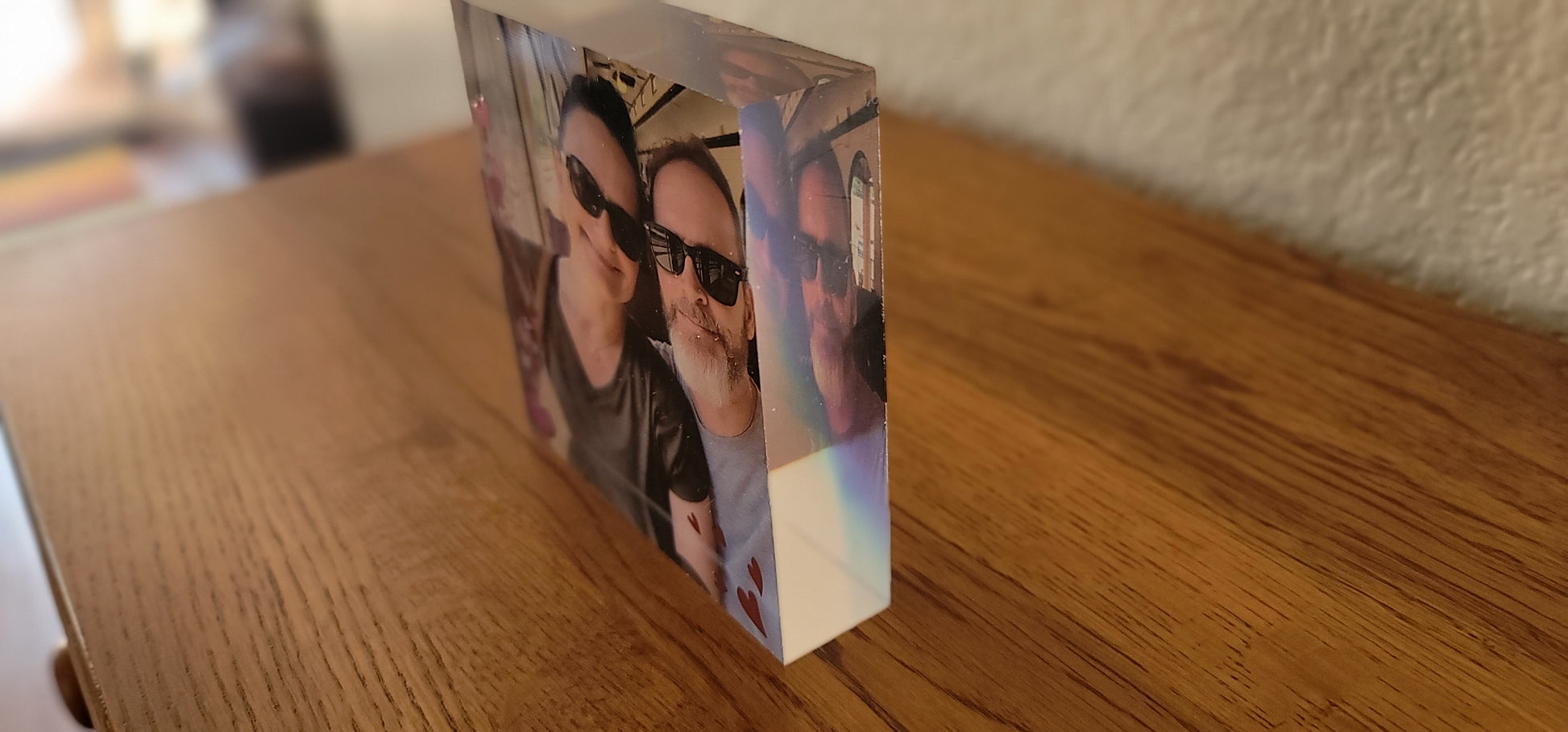 Acrylic photo block measuring 4" X 4" X 1" with photo printed on the back and details printed on the front. 
